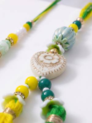 set of 2 green & yellow beaded heart shape bhaiya bhabhi rakhi with roli chawal 3