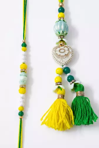 set of 2 green & yellow beaded heart shape bhaiya bhabhi rakhi with roli chawal