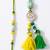 set of 2 green & yellow beaded heart shape bhaiya bhabhi rakhi with roli chawal