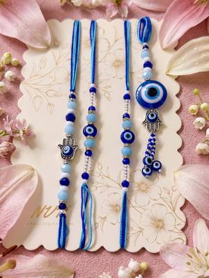 set of 4 designer blue evil eye thread rakhi with roli chawal chandan mishri 1