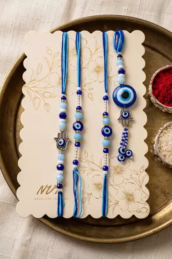 set of 4 designer blue evil eye thread rakhi with roli chawal chandan mishri