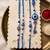 set of 4 designer blue evil eye thread rakhi with roli chawal chandan mishri