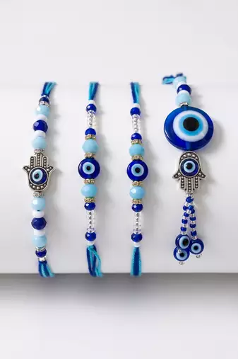 set of 4 designer blue evil eye thread rakhi with roli chawal chandan mishri