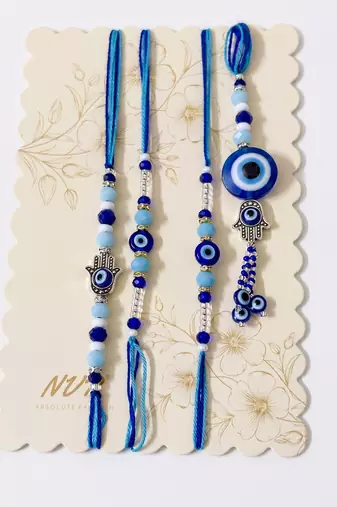 set of 4 designer blue evil eye thread rakhi with roli chawal chandan mishri