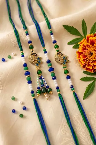 set of 4 green peacock design artificial beads thread rakhi with roli chawal