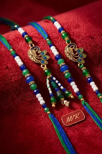 set of 4 green peacock design artificial beads thread rakhi with roli chawal