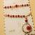 set of 2 gold toned red artificial beads bhaiya bhabhi rakhi with roli chawal chandan
