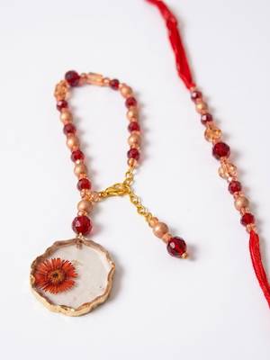 set of 2 gold toned red artificial beads bhaiya bhabhi rakhi with roli chawal chandan 3