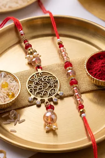 set of 2 gold toned artificial stones & beads bhaiya bhabhi rakhi with roli chawal
