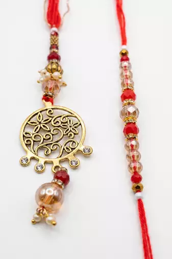 set of 2 gold toned artificial stones & beads bhaiya bhabhi rakhi with roli chawal