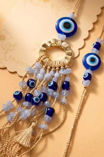 set of 2 gold toned round evil eye bhaiya bhabhi rakhi with roli chawal chandan mishri