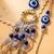 set of 2 gold toned round evil eye bhaiya bhabhi rakhi with roli chawal chandan mishri