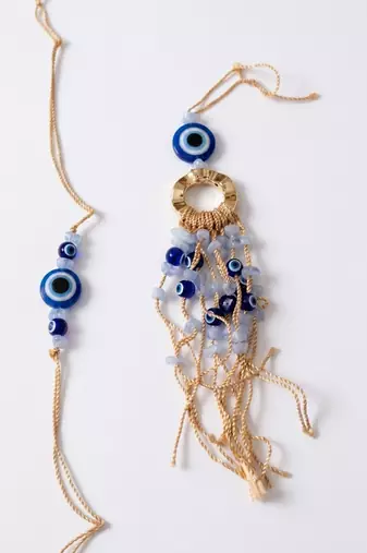 set of 2 gold toned round evil eye bhaiya bhabhi rakhi with roli chawal chandan mishri