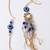 set of 2 gold toned round evil eye bhaiya bhabhi rakhi with roli chawal chandan mishri