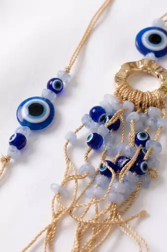 set of 2 gold toned round evil eye bhaiya bhabhi rakhi with roli chawal chandan mishri