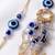 set of 2 gold toned round evil eye bhaiya bhabhi rakhi with roli chawal chandan mishri