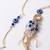 set of 2 gold toned round evil eye bhaiya bhabhi rakhi with roli chawal chandan mishri