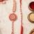 set of 2 gold toned pearls & beads round shape bhaiya bhabhi rakhi with roli chawal
