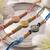 set of 3 floral design multicolor artificial beads thread rakhi with roli chawal
