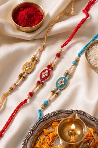 set of 3 multicolor artificial beads & white pearls thread rakhi with roli chawal