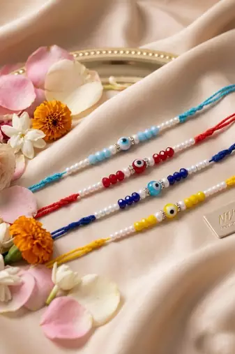 set of 4 multicolor evil eye thread rakhi with roli chawal chandan mishri