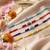 set of 4 multicolor evil eye thread rakhi with roli chawal chandan mishri