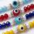 set of 4 multicolor evil eye thread rakhi with roli chawal chandan mishri