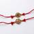set of 2 gold toned artificial stones thread rakhi with roli chawal chandan mishri