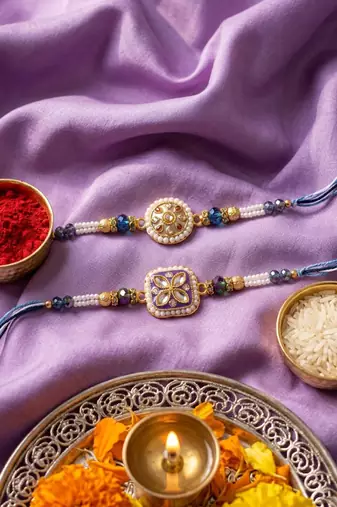 set of 2 white pearls thread rakhi with roli chawal chandan mishri