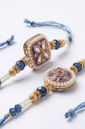 set of 2 white pearls thread rakhi with roli chawal chandan mishri