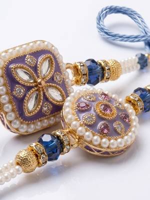 set of 2 white pearls thread rakhi with roli chawal chandan mishri 4