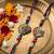 set of 2 multicolor artificial stones & beads thread rakhi with roli chawal chandan