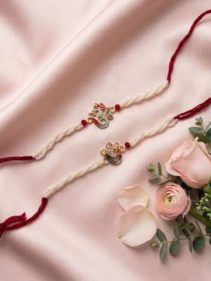 set of 2 white pearls om & ganesh ji thread rakhi with roli chawal chandan mishri 1