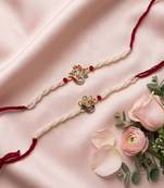 set of 2 white pearls om & ganesh ji thread rakhi with roli chawal chandan mishri