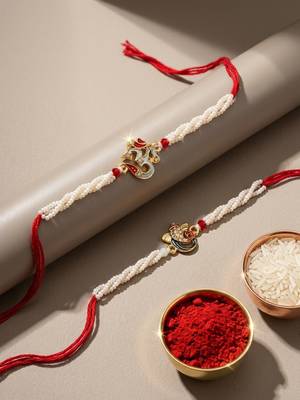 set of 2 white pearls om & ganesh ji thread rakhi with roli chawal chandan mishri 2