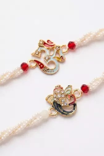 set of 2 white pearls om & ganesh ji thread rakhi with roli chawal chandan mishri