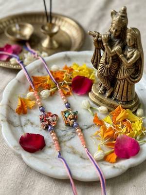 set of 2 krishna ji & ganesh ji beaded religious thread rakhi with roli chawal 1