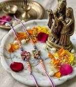 set of 2 krishna ji & ganesh ji beaded religious thread rakhi with roli chawal