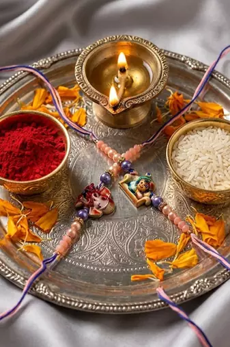 set of 2 krishna ji & ganesh ji beaded religious thread rakhi with roli chawal