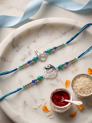 set of 2 silver toned beaded religious thread rakhi with roli chawal chandan mishri 2