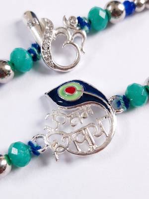 set of 2 silver toned beaded religious thread rakhi with roli chawal chandan mishri 4