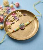 multicolor artificial beads ganesh ji thread rakhi with roli chawal chandan mishri