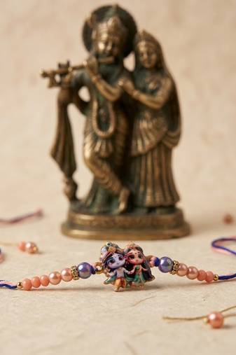 radha krishna multicolor artificial beads thread rakhi with roli chawal chandan mishri