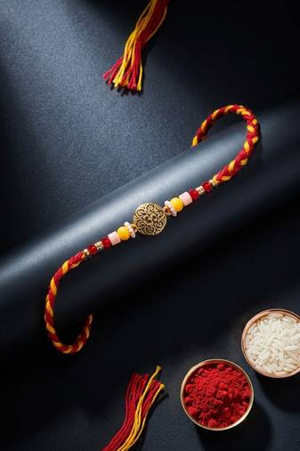artificial beads decorative om design religious thread rakhi with roli chawal chandan