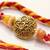 artificial beads decorative om design religious thread rakhi with roli chawal chandan