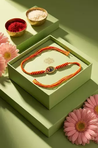 om motif divine religious thread rakhi with roli chawal chandan mishri