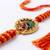 om motif divine religious thread rakhi with roli chawal chandan mishri