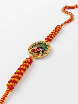om motif divine religious thread rakhi with roli chawal chandan mishri 4