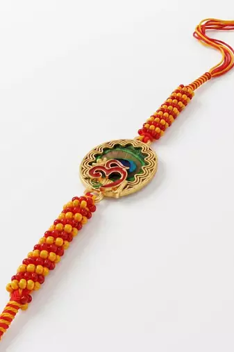 om motif divine religious thread rakhi with roli chawal chandan mishri