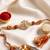 rudraksh & kundan studded gold toned thread rakhi with roli chawal chandan mishri